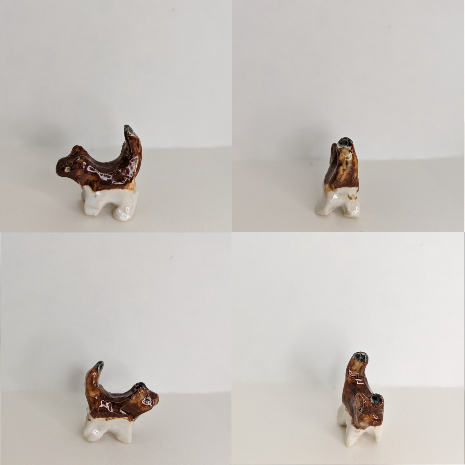 4 views of a small brown and white ceramic kitten.