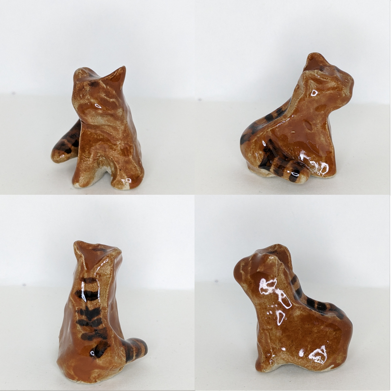 4 views of a ceramic cat in a sitting pose. It is brown with stripes.