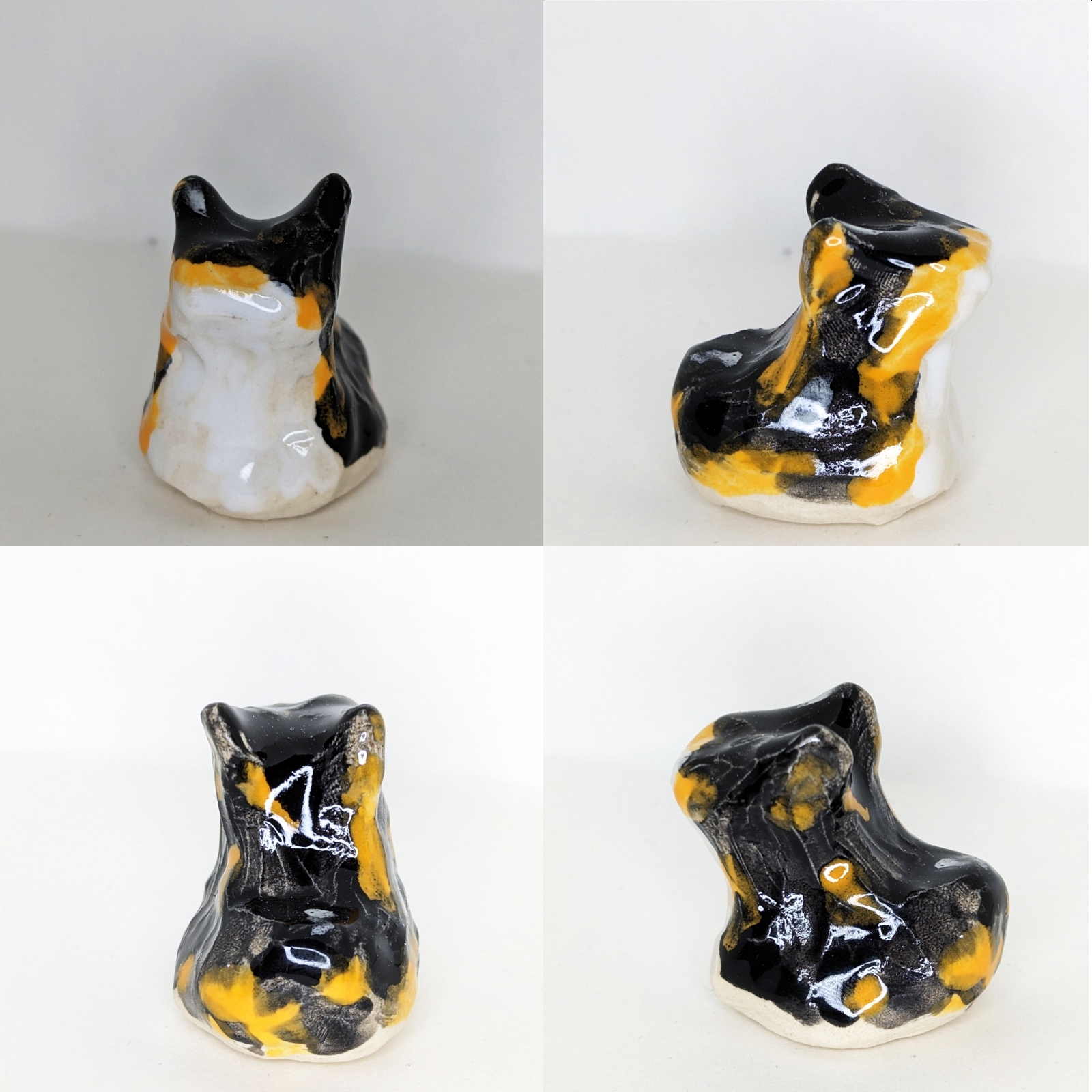 4 views of a ceramic calico cat in the sitting loaf position.